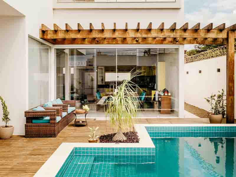 Outdoor patio with pool and pergola