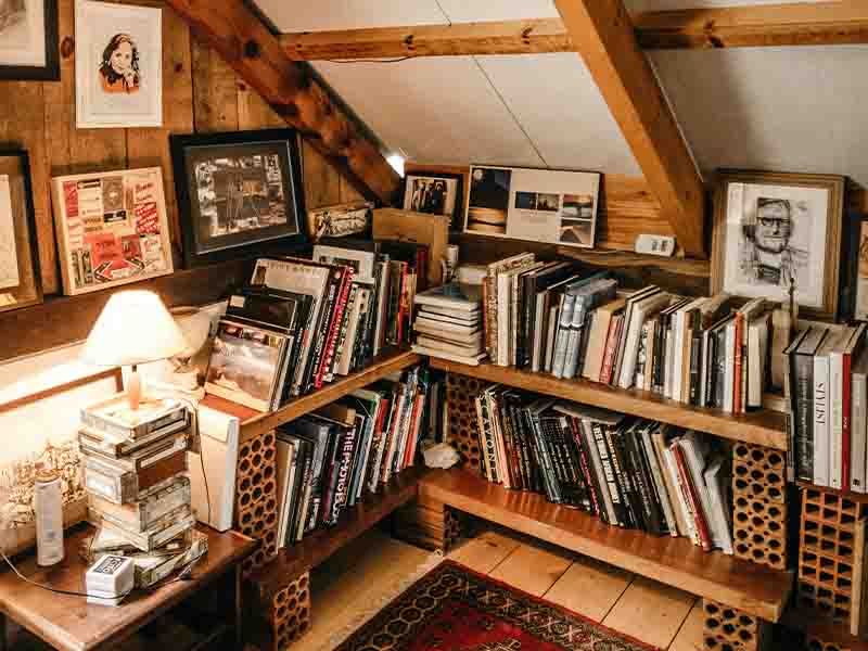Attic corner reading nook with books and chair