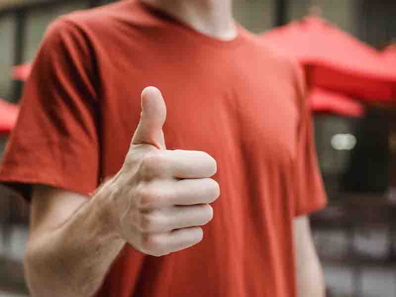 Man giving thumbs up sign