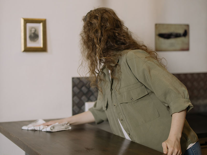 Woman wiping down counter