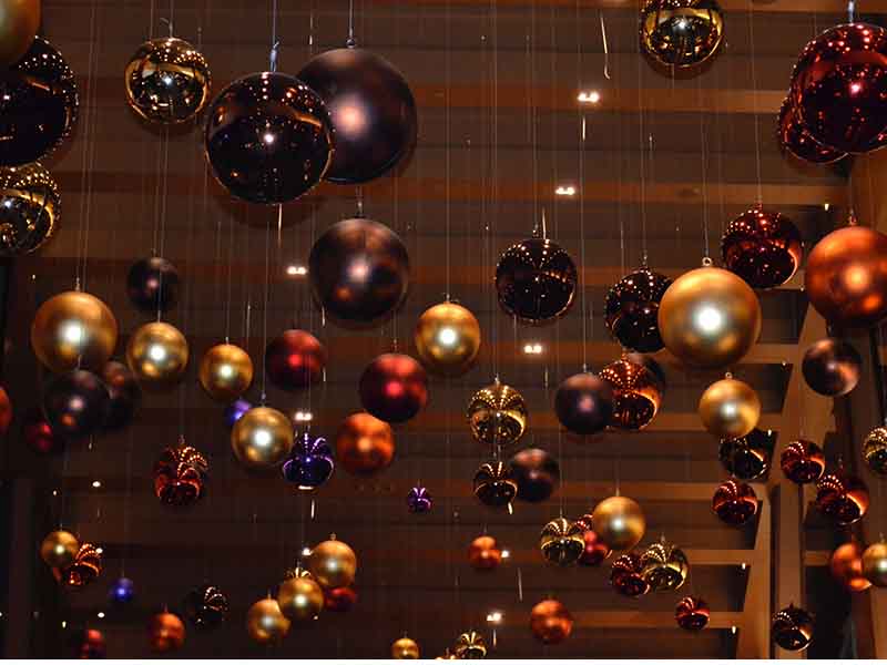 Christmas ornaments hanging from hotel ceiling