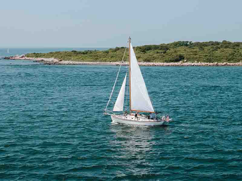 White Sailboat on blue water in Martha's Vineyard 