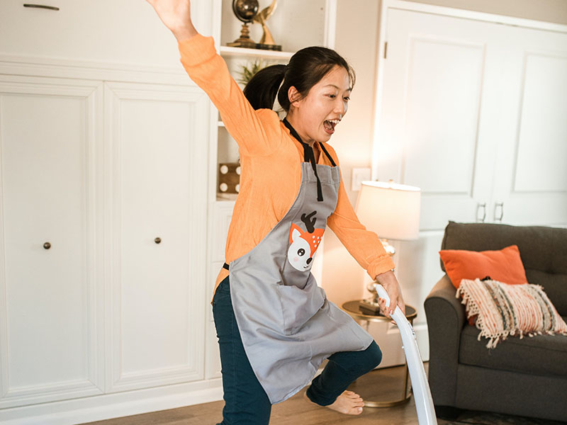Woman vacuuming living room